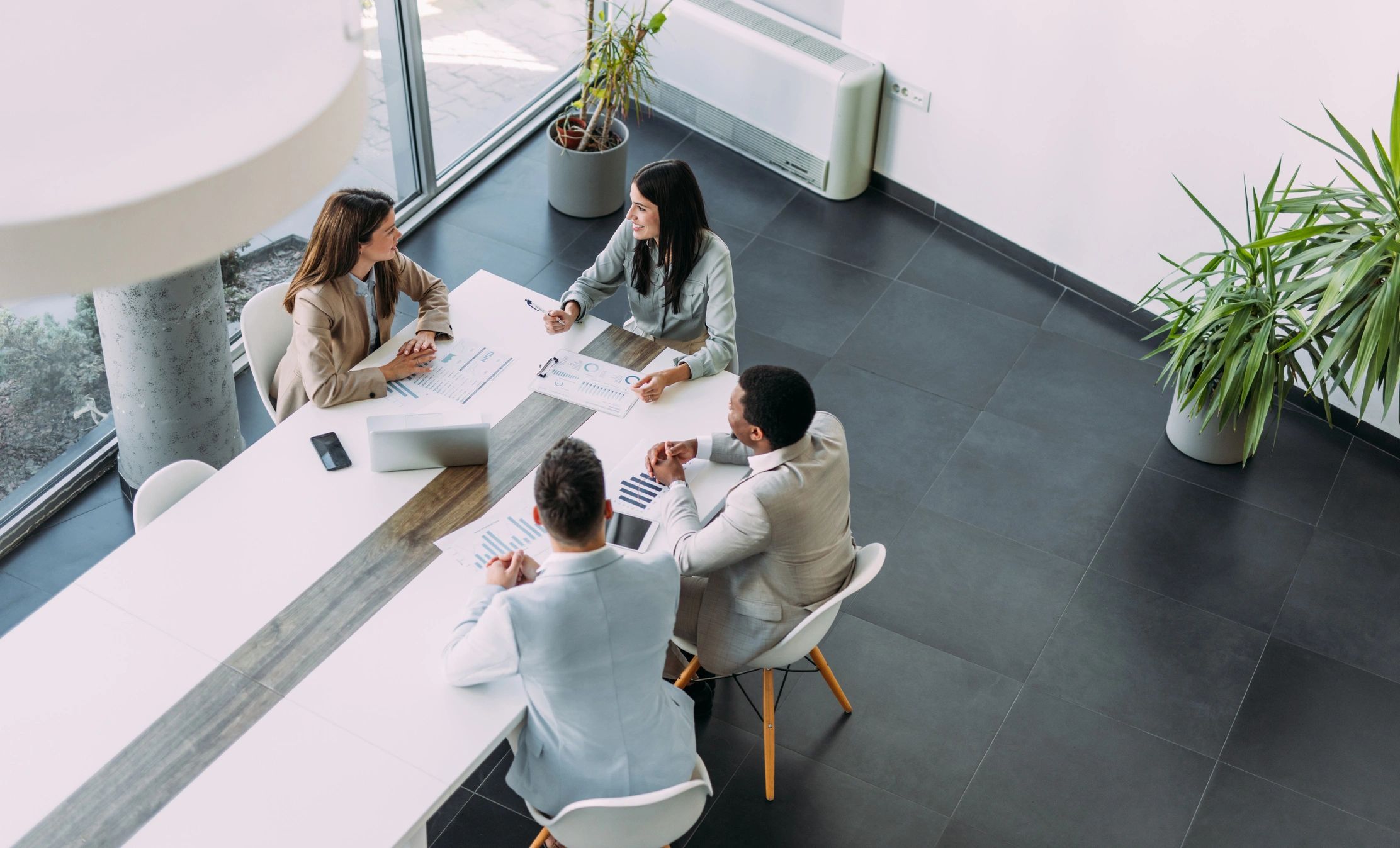 Consultants collaborating in a boardroom meeting