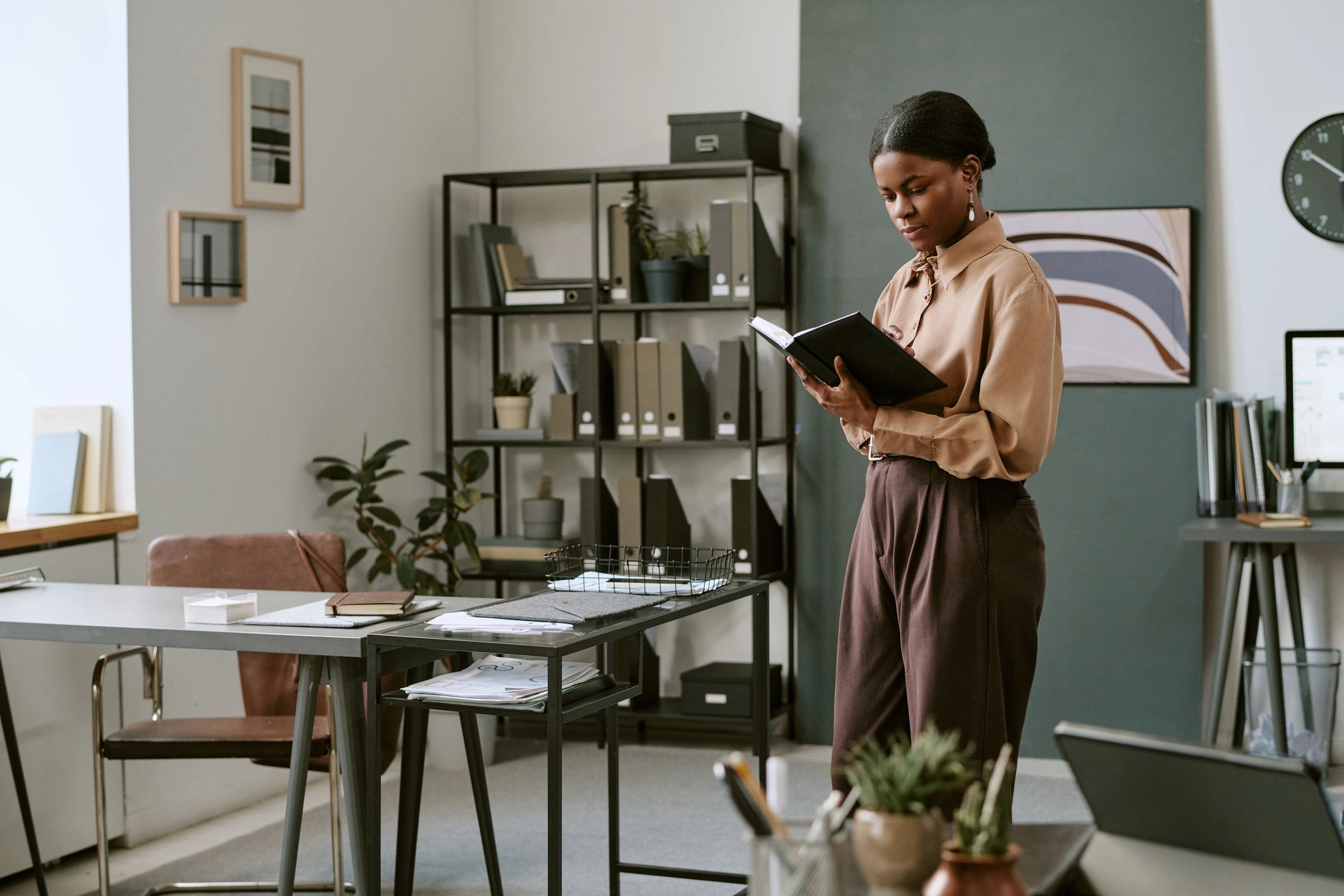 Consultant reviewing business planning documents in an office